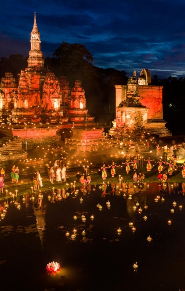 Candlelit temple ruins at Sukhothai during the Loy Krathong festival