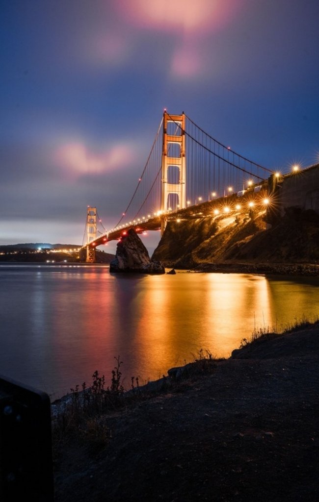 The Golden Gate Bridge lit up at night