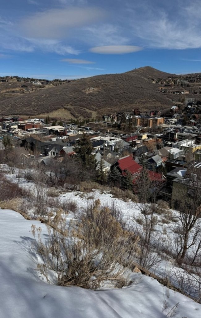 Snowy rooftops and mountains above Park City in winter