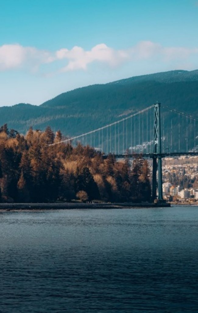 The Lions Gate Bridge spanning the inlet beneath forested mountains