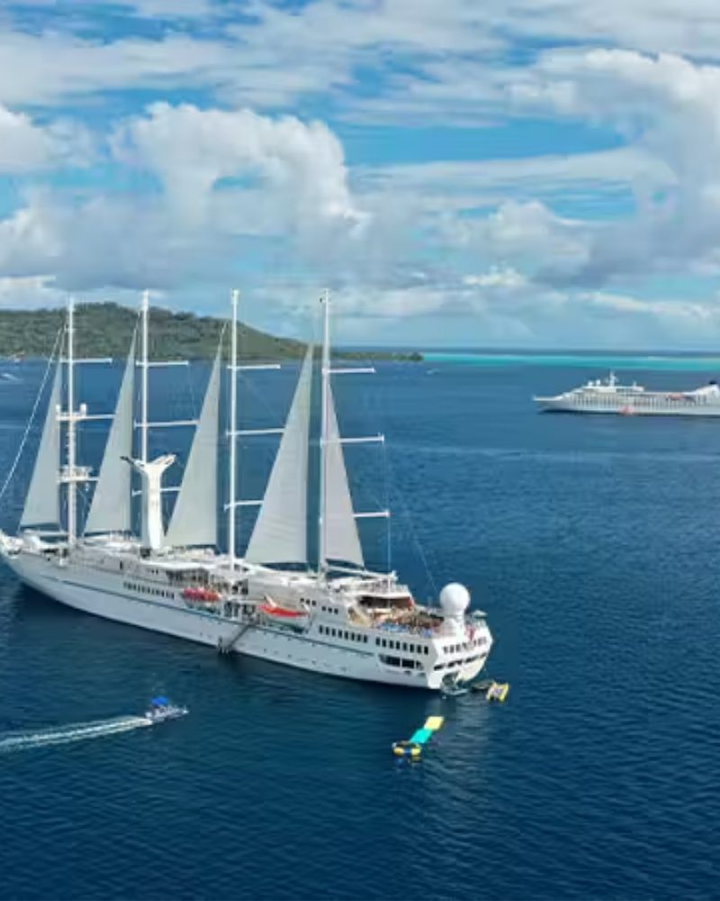 A Windstar sailing yacht at anchor with its watersports platform open