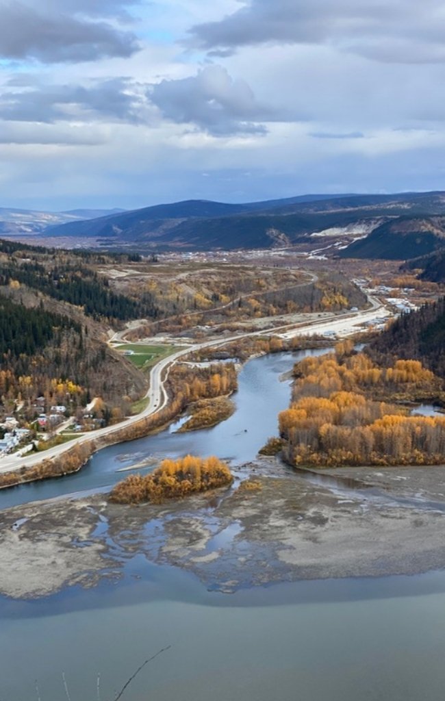 A river winding through an autumn valley in the Yukon